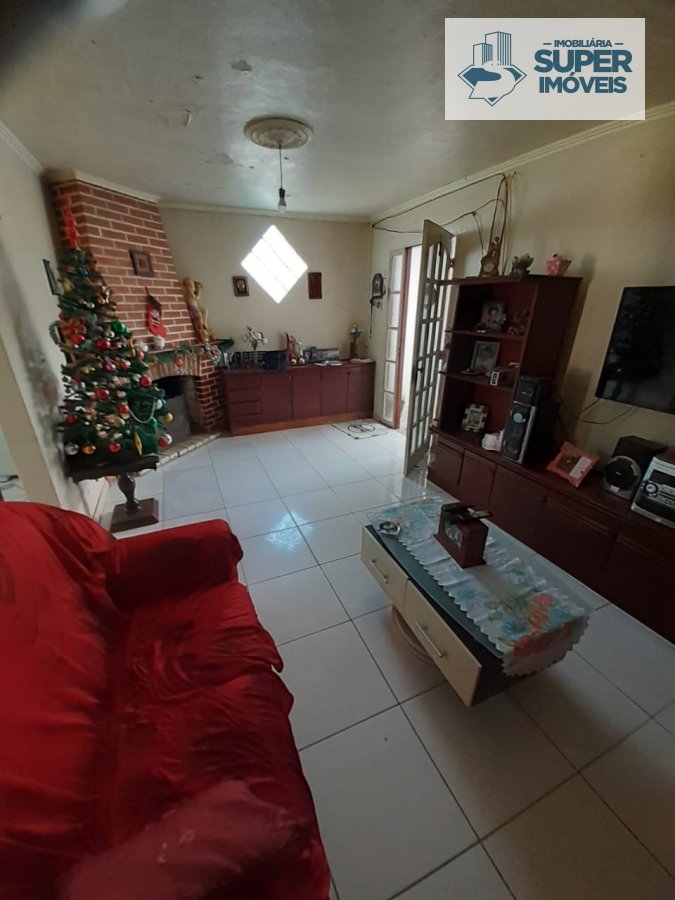 Casa a Venda no bairro Areal em Pelotas - RS. 2 banheiros, 4 dormitórios, 3 vagas na garagem, 2 cozinhas,  área de serviço,  sala de estar,  sala de j